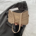 Beige faux leather baguette bag with a gold bow accent and an adjustable shoulder strap - Khaki