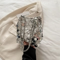 Sparkling silver sequin bucket bag with metal chain strap in high-end fashion style - Silver
