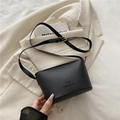 Chic black litchi pattern leather bucket bag with logo and gold hardware details - Black