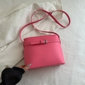 Chic vibrant pink bucket bag with litchi texture and adjustable crossbody strap - Pink