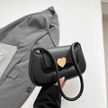 Chic black underarm bag with golden heart buckle and slim straps in minimalist style - Black