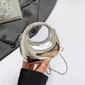 Glossy silver mini dumpling bag with metallic chain and circular hollow handle - Silver