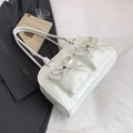 Creamy white bow-knot shoulder bag with metallic rivets and functional front pockets - White