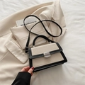 Beige and black textured small square bag with silver metal turn lock and shoulder strap - White