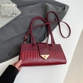 Burgundy handbag with mixed smooth and crocodile embossed leather and gold clasp - Red
