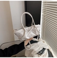 Detail of white matte leather handbag featuring a decorative bow and detachable strap - White