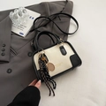 Fashionable bicolor leather Boston bag in creamy white and black with tennis racket charm - With Pendant / White and Black