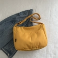 Vibrant yellow nylon crossbody bag with dual front pockets and adjustable strap for summer - Yellow