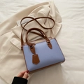 Lavender contrast handbag in lychee leather with brown handles and long shoulder strap - Blue
