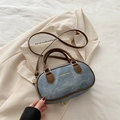 Retro denim bowling bag in faded blue with brown leather handles and shoulder strap - Blue