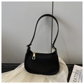 Detail of black litchi grain leather shoulder bag with gold zipper and minimalist design - Black