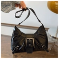 Detail view of black faux leather shoulder bag with vintage silver buckle hardware - Black