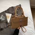 Khaki croc-embossed kelly bag with top handles and silver twist-lock closure - Khaki