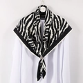 Elegant zebra print silk square scarf with animal pattern on a camellia hanger - White Border with Black