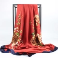 Detail of red satin scarf with peony floral pattern and navy blue border hanging - Red Border Peony (#16)