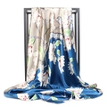Detailed drape of large silk scarf featuring elegant floral patterns and champagne blue hues - Blue Gold Magnolia (#3)