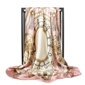 Close-up of pink chain print satin silk scarf draped over a black metal hanger - Pink