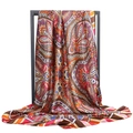 Detailed view of colorful paisley satin silk scarf draped on a metal stand - Retro Paisley Print / Brown