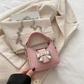Mini light pink bow-knot handbag with silver chain strap and synthetic leather finish - Pink