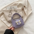 Mini lavender crossbody bag with silver bow accent and chain strap for girls - Purple