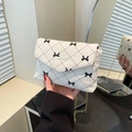 White corduroy crossbody bag with diamond pattern, bow accents and gold chain strap - White Bow