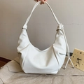 Minimalist white PU leather hobo shoulder bag with knot strap detail and crescent shape - Off-white