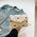 Cream corduroy shoulder bag with black bow print and gold chain strap for women - White Bow Style