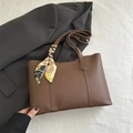 Brown faux leather tote bag with vintage scarf accent on white textured fabric - Dark Brown