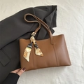 Classic brown leather tote bag with elegant printed scarf handle for office and daily commute - Tan