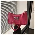 Detail of pink PU leather handbag featuring silver bow and geometric pattern - Rose Pink
