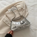 Chic silver metallic Y2K hobo bag with eyelet straps and buckle details in a stylish design - Silver