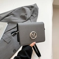 Gray twill crossbody bag with silver M logo and black leather straps for women - Black