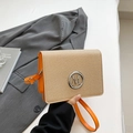 Chic orange square crossbody bag with beige woven texture and silver metal M logo - Orange