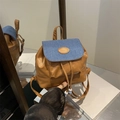Vintage brown leather backpack with blue denim flap and drawstring closure detail - Brown & Denim Blue Patchwork / Brown