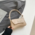 Elegant beige shoulder bag with a gold metal bow and a creative knotted strap design - Khaki