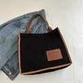 Borsa tote minimalista in velluto nero con manici marroni e toppa alla moda - Nero
