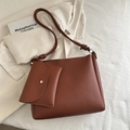 Brown leather crossbody tote bag with matching pouch and decorative ring details - Brown