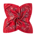 Detailed macro view of red paisley print satin scarf with smooth silky texture - Red