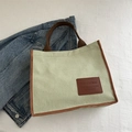 Green corduroy tote bag with brown trim and leather patch for daily commuting - Green