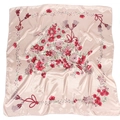 Close-up of pink floral silk scarf showing elegant flower patterns and smooth satin texture - Dusky Pink