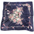 Detailed view of the dark blue silk scarf with floral prints and tassel patterns - Navy Blue