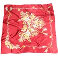 Detail of red floral silk scarf featuring yellow flower pattern and tassel border - Red