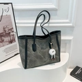 Grey vintage tote bag with long black straps and a white fluffy charm on white pedestal - With Pendant / Gray