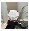 Detail of white shell-shaped mini bag with pearl handle and golden hardware finish - White