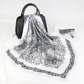 90x90cm black and white paisley silk scarf draped over a black handbag stylishly - 90*90cm / Black and White Paisley