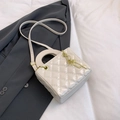 Quilted ivory crossbody bag with round handle and gold key pendant charm accent - No Pendant / White