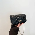 Classic black quilted shoulder bag with gold twist lock and elegant chain strap details - Black