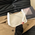 White patent leather baguette underarm bag with gold hardware for women's spring 2025 fashion - White