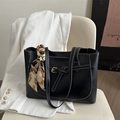 Chic black faux leather tote bag with contrast stitching and decorative scarf accessory - Black