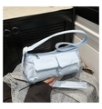 Detail of light blue quilted nylon crossbody bag with dual front flap pockets - Blue